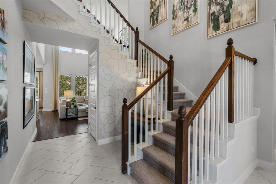 Lovely views of the stairwell and common area from the entrance foyer.