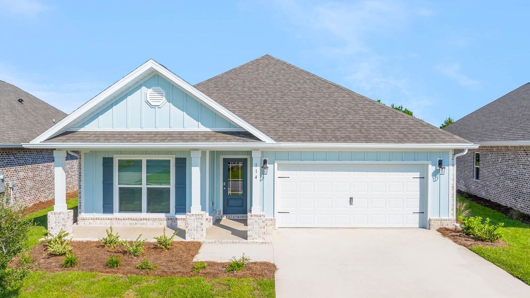 Front exterior of a new home in Owl's Head Farms, Freeport, FL, highlighting curb appeal (Image 1). Front exterior of a new home in Owl's Head Farms, Freeport, FL, highlighting curb appeal (Image 1).