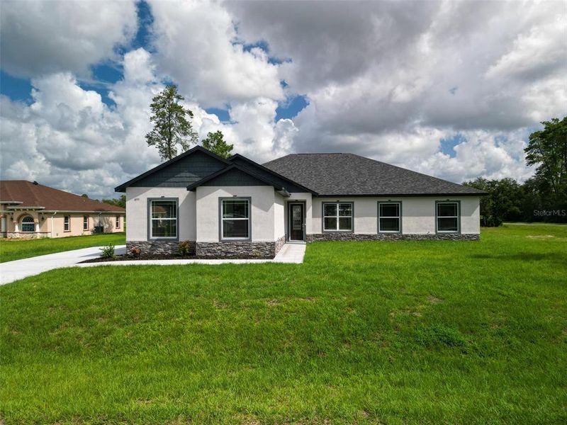 Front exterior of a new home in , Ocala, FL, highlighting curb appeal (Image 28). Front exterior of a new home in , Ocala, FL, highlighting curb appeal (Image 28).