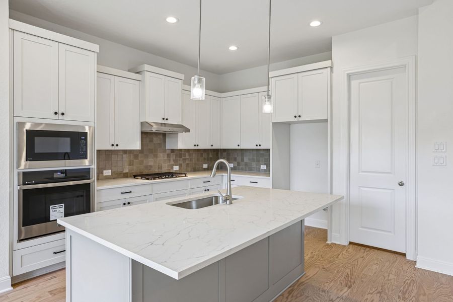 Furnished interior view inside a new home in 6 Creeks, Kyle (Image 5).