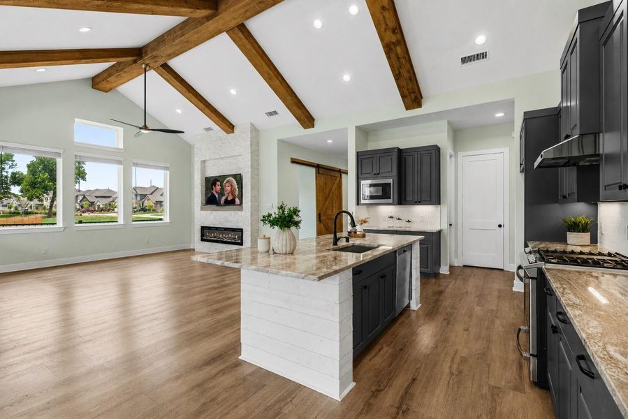 The Kitchen is thoughtfully appointed with a premium, stainless steel GE appliance package. Designed to meet the needs of both casual cooks and avid entertainers, it features a 4-burner gas range with an integrated griddle, oven with storage drawer below, built-in microwave, and a whisper-quiet dishwasher that delivers powerful cleaning with minimal disruption.