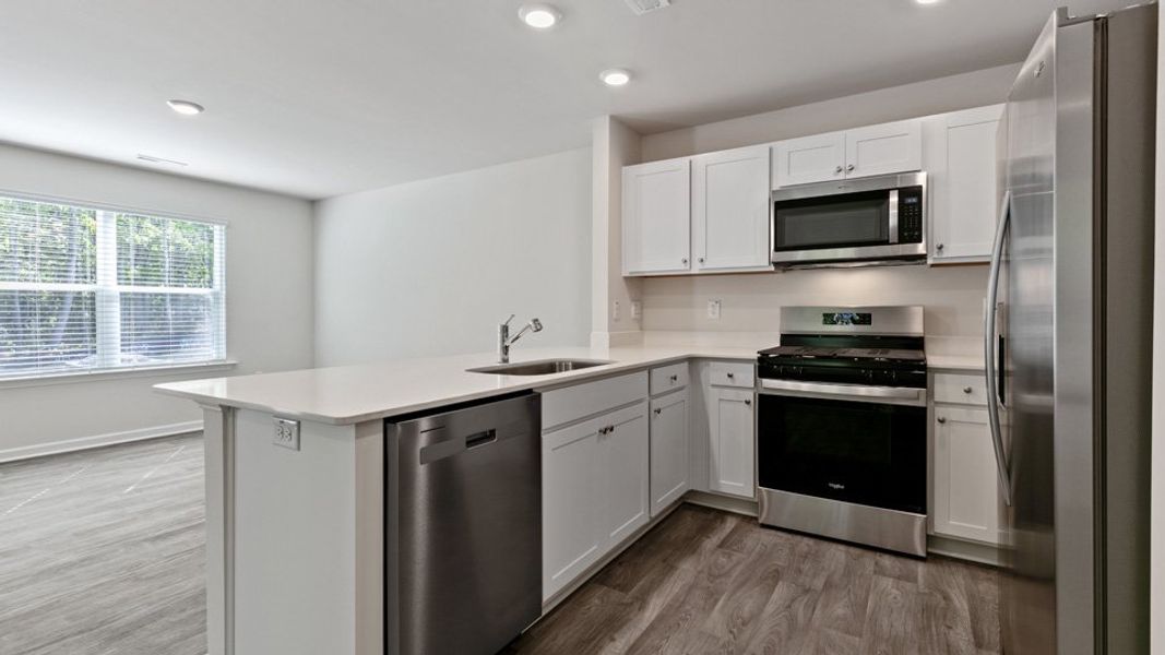 Furnished interior view inside a new home in Edinborough Townes, Gibsonville (Image 4).