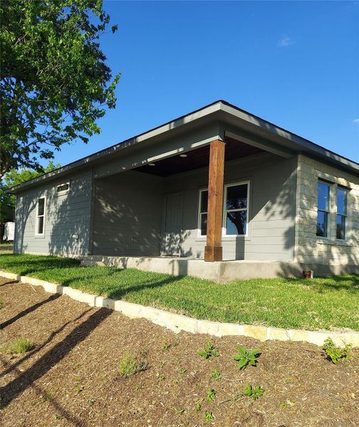 View of property exterior featuring a beautiful covered patio.