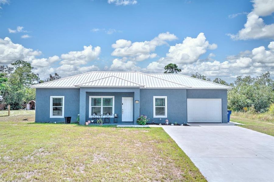 Front exterior of a new home in , Lake Placid, FL, highlighting curb appeal (Image 1). Front exterior of a new home in , Lake Placid, FL, highlighting curb appeal (Image 1).
