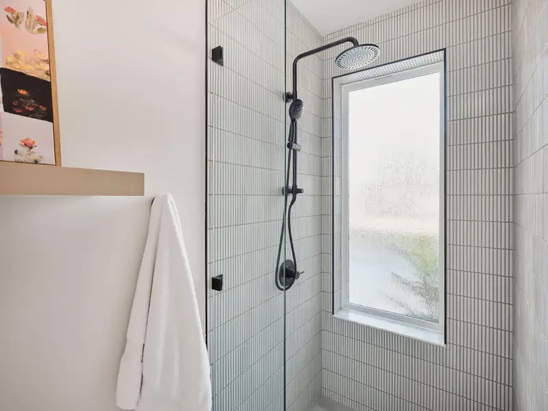Bathroom featuring tiled shower