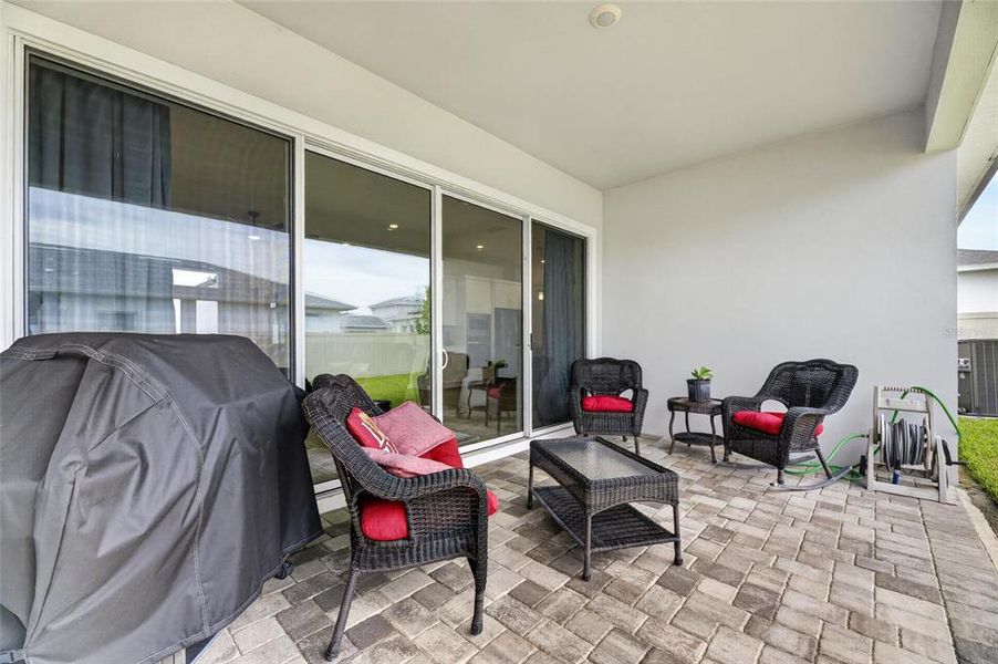 Exterior details and patio area of a home in Robin's Cove at Epperson, Wesley Chapel (Image 32).
