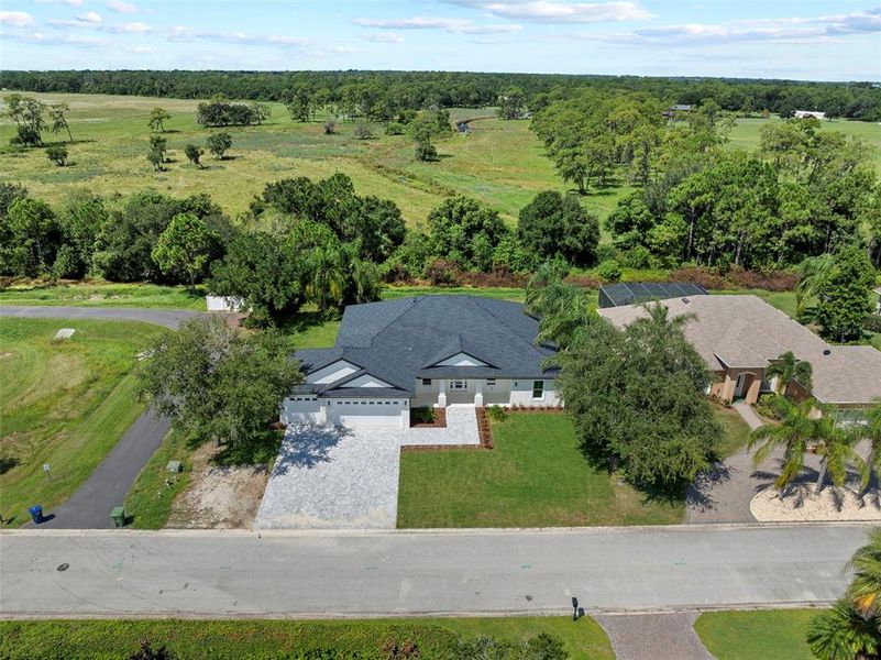 Front exterior of a new home in , Winter Haven, FL, highlighting curb appeal (Image 26).