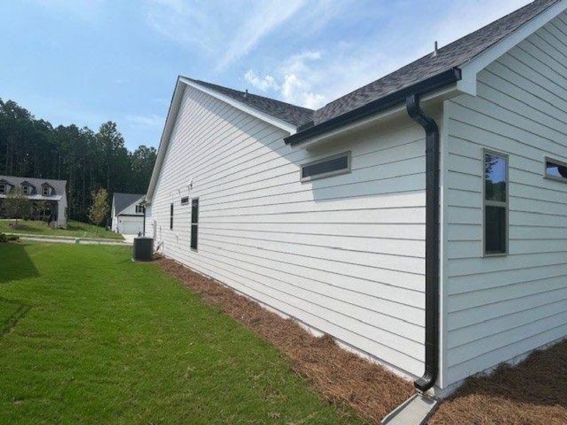 Exterior details and patio area of a home in Soleil Belmont Park, Canton (Image 10).