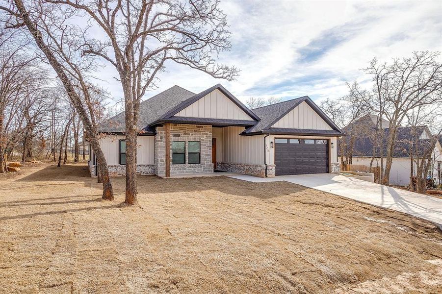 Front exterior of a new home in , Runaway Bay, TX, highlighting curb appeal (Image 28). Front exterior of a new home in , Runaway Bay, TX, highlighting curb appeal (Image 28).