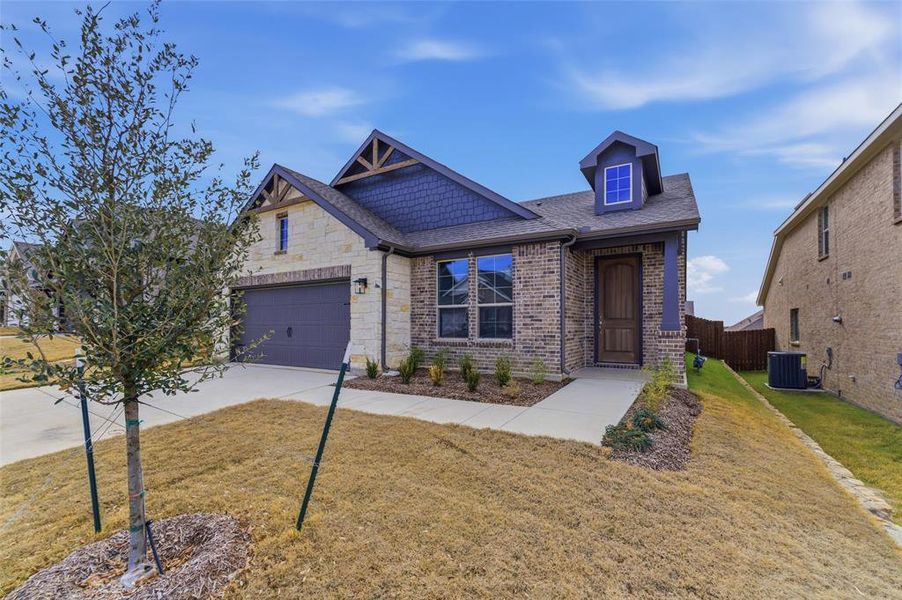 Front exterior of a new home in Liberty Pointe, Gainesville, TX, highlighting curb appeal (Image 20).