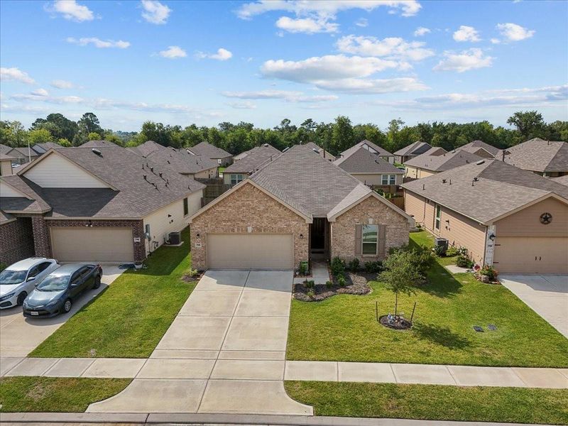 Front exterior of a new home in , Alvin, TX, highlighting curb appeal (Image 21).