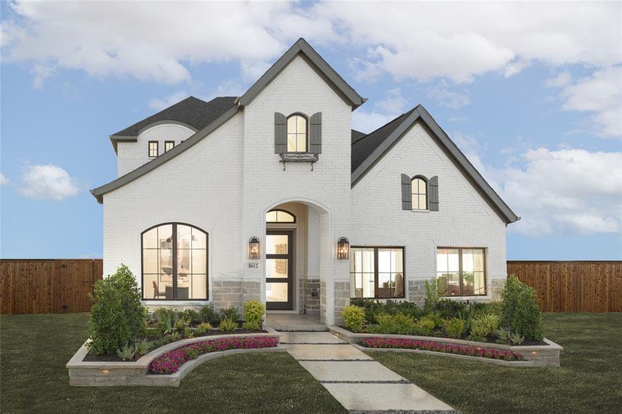 Front exterior of a new home in The Tribute 50', The Colony, TX, highlighting curb appeal (Image 1).