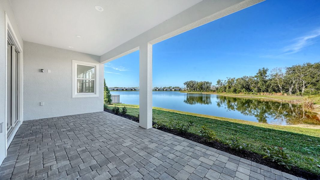 Exterior details and patio area of a home in Wildleaf, Parrish (Image 32).