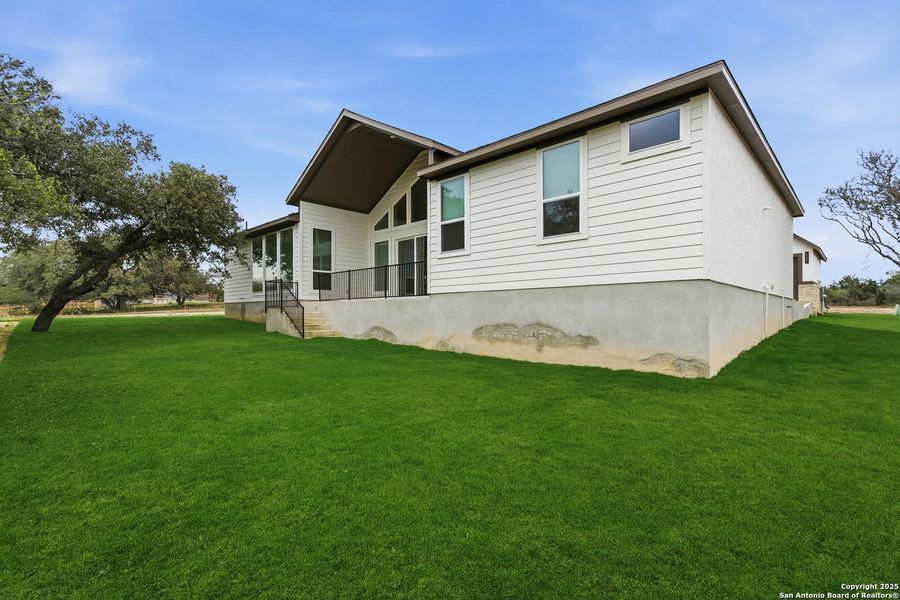 Exterior details and patio area of a home in Potranco Oaks, Castroville (Image 4).