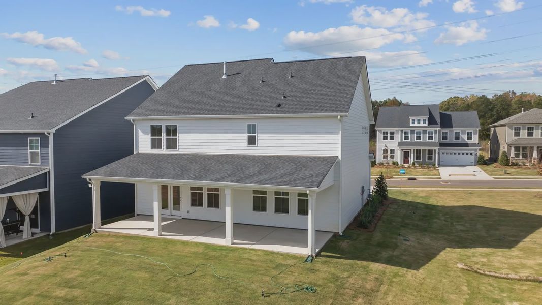 Burton Design large rear covered porch at Lakeside Glen by premier builder DRB Homes in York, SC.
