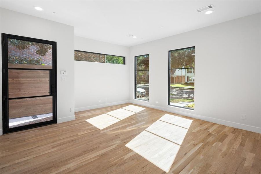 Unfurnished room with light wood-type flooring