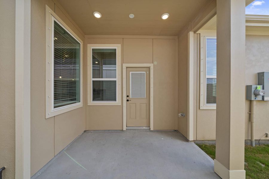 Exterior details and patio area of a home in Meridiana, Manvel (Image 3).