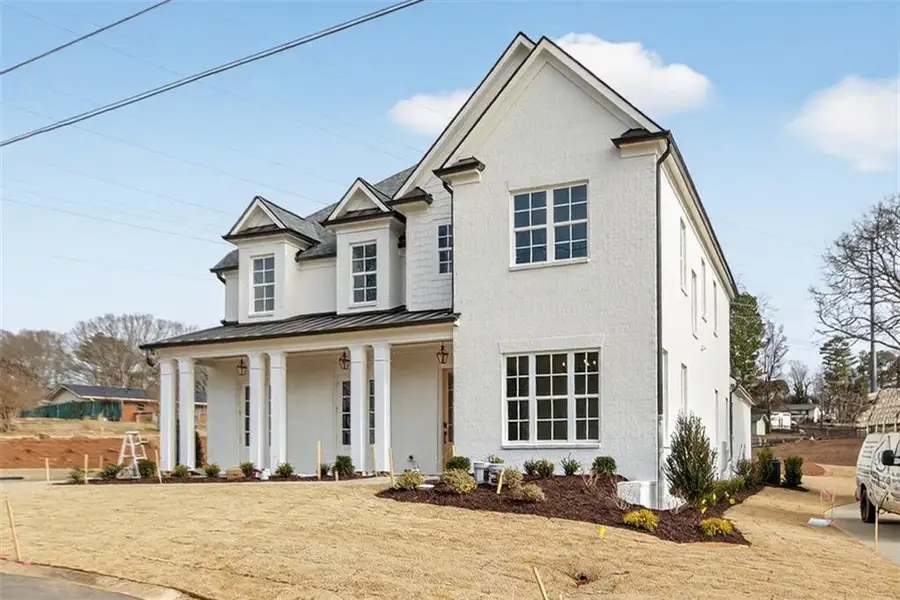 Front exterior of a new home in , Suwanee, GA, highlighting curb appeal (Image 2). Front exterior of a new home in , Suwanee, GA, highlighting curb appeal (Image 2).