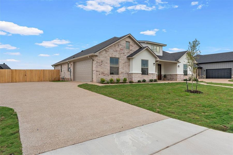 Front exterior of a new home in , Robinson, TX, highlighting curb appeal (Image 23).