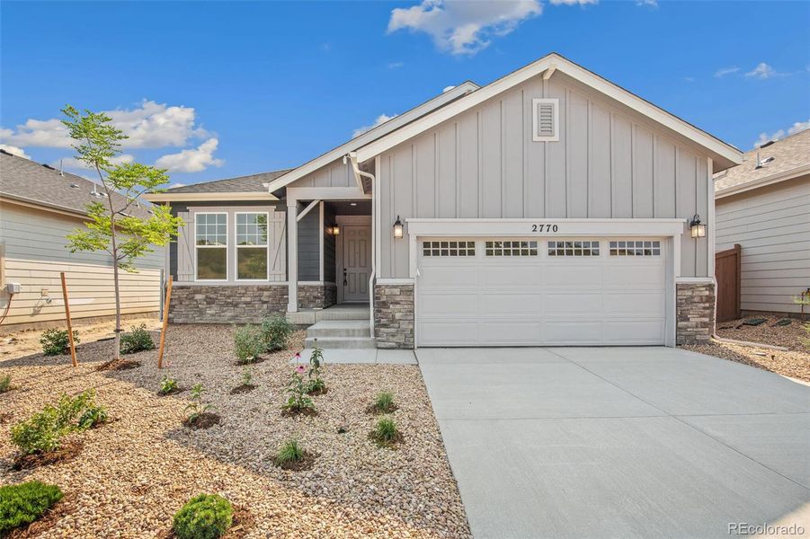 Front exterior of a new home in Terrain Oak Valley, Castle Rock, CO, highlighting curb appeal (Image 19).