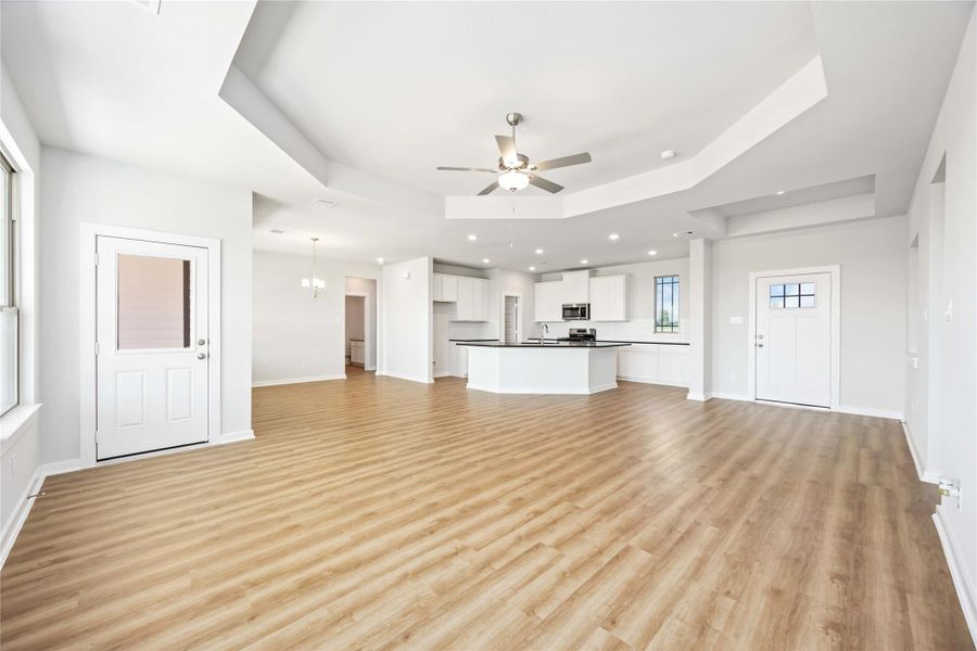 Enjoy an open-concept family room and island kitchen with a walk-in pantry, breakfast area and plenty of natural light.