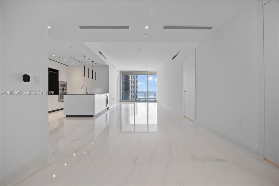 Spacious, unfurnished interior of a new home in Aston Martin Residences, Miami (Image 31).