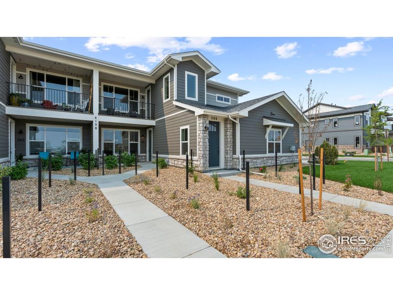 Front exterior of a new home in The Lakes at Centerra - Discovery, Loveland, CO, highlighting curb appeal (Image 1).