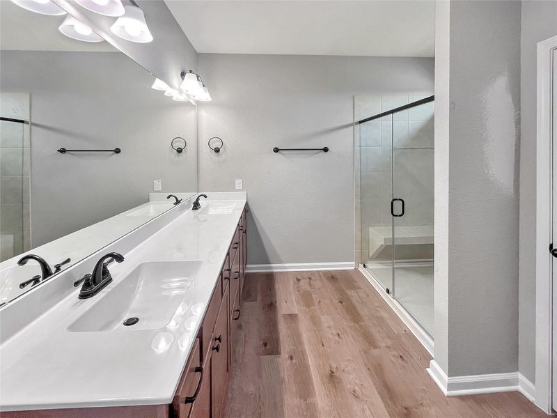 The Oakshire II- Primary Bathroom with Large Walk-in Shower and Dual Vanities