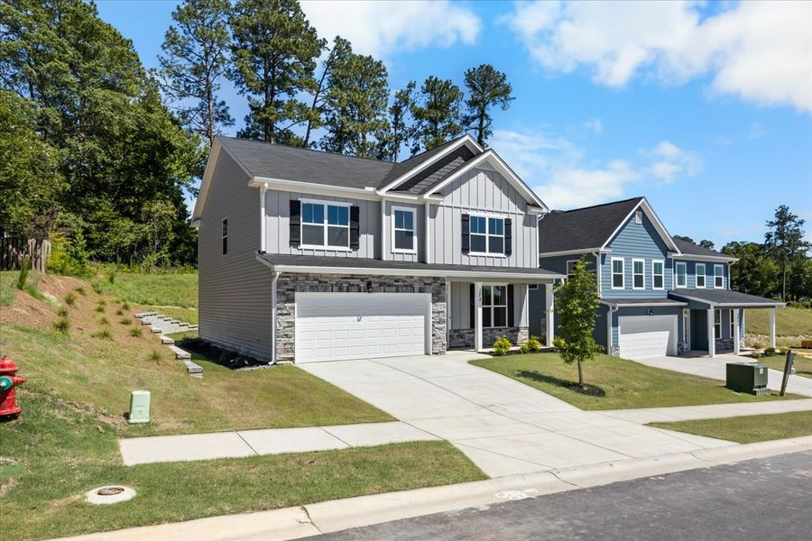 Front exterior of a new home in Forrest Bluff, North Augusta, SC, highlighting curb appeal (Image 20). Front exterior of a new home in Forrest Bluff, North Augusta, SC, highlighting curb appeal (Image 20).