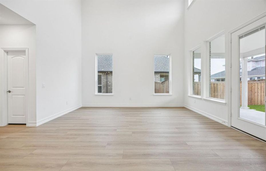 Spacious gathering room with large windows *Model Representation*