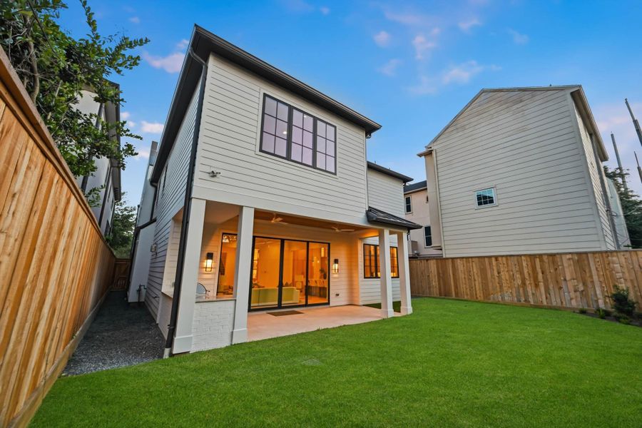 Out back you'll find a stunning covered patio and room for a pool!
