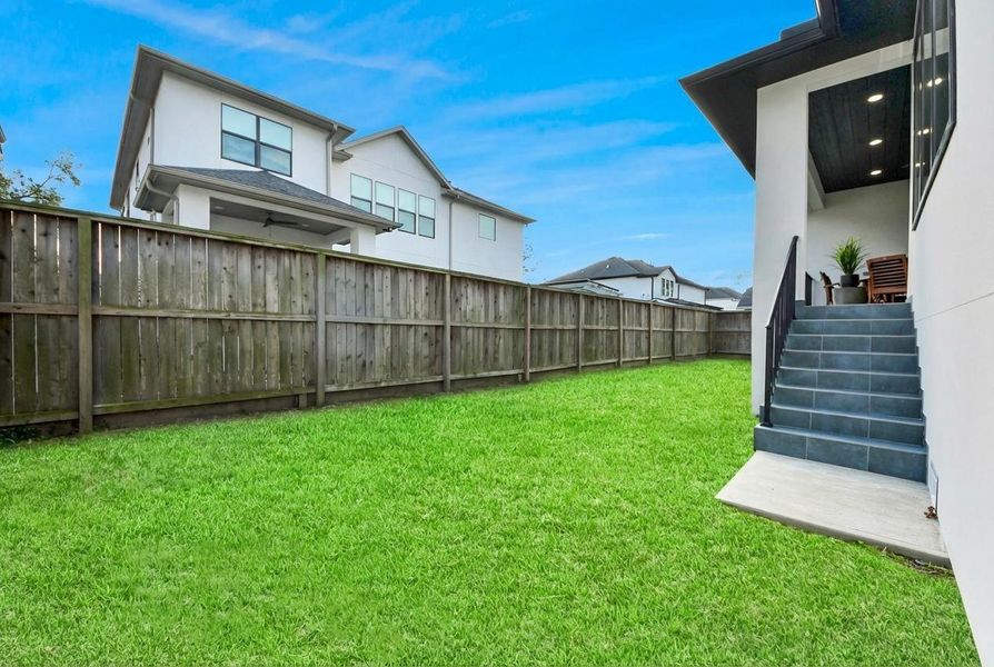 The backyard provides a serene outdoor escape for quiet, peaceful evenings.