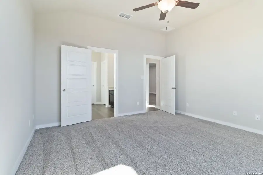 Spacious, unfurnished interior of a new home in Hunters Ranch, San Antonio (Image 18).