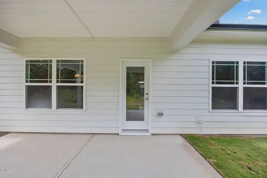 Exterior details and patio area of a home in Charlotte's Ridge, Middlesex (Image 3).