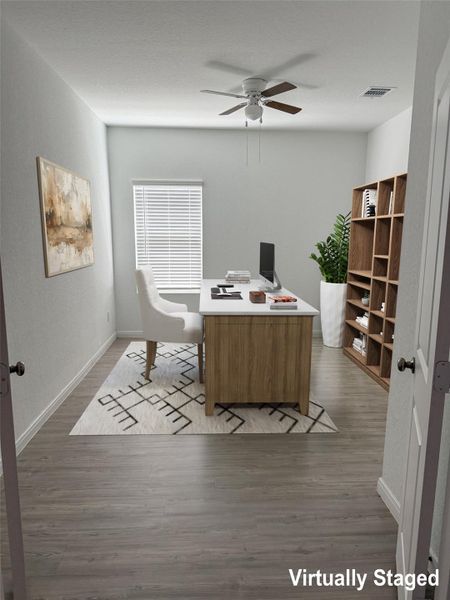 An inviting home office with abundant natural light and ample workspace for productivity.