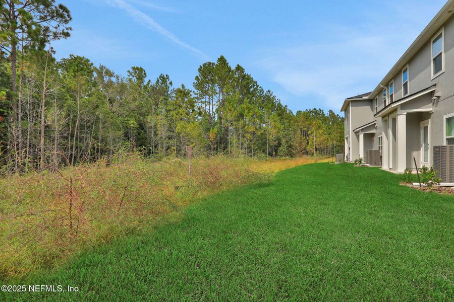 Front exterior of a new home in Atlantis Pointe, Middleburg, FL, highlighting curb appeal (Image 20).
