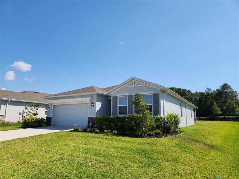 Front exterior of a new home in , Ocala, FL, highlighting curb appeal (Image 2).