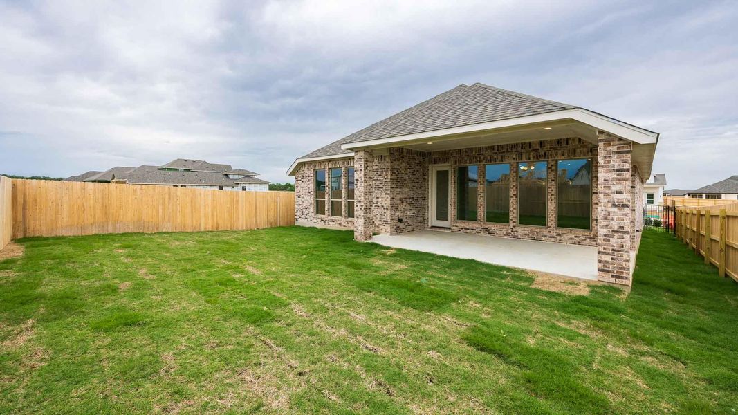 Exterior details and patio area of a home in Santa Rita Ranch - Tierra Rosa, Liberty Hill (Image 2).