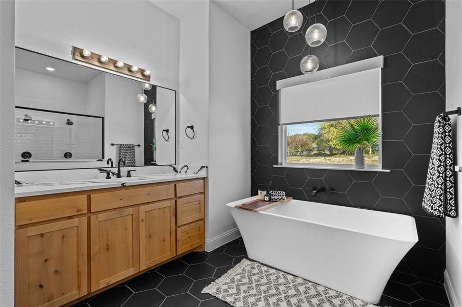 Bathroom with tile patterned floors, vanity, independent shower and bath, and tile walls