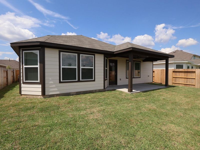 Front exterior of a new home in Pinewood at Grand Texas, New Caney, TX, highlighting curb appeal (Image 14). Front exterior of a new home in Pinewood at Grand Texas, New Caney, TX, highlighting curb appeal (Image 14).