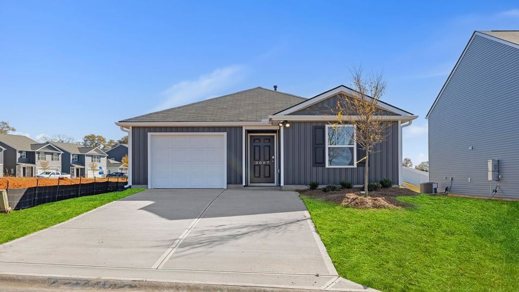 Front exterior of a new home in Baxter Village, Boiling Springs, SC, highlighting curb appeal (Image 1).