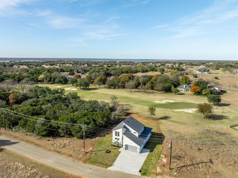 Front exterior of a new home in , Whitney, TX, highlighting curb appeal (Image 19). Front exterior of a new home in , Whitney, TX, highlighting curb appeal (Image 19).