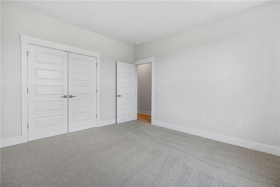A spacious bedroom provides a blank canvas, offeri A spacious bedroom provides a blank canvas, offeri