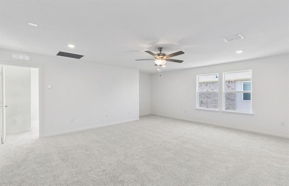 Spacious game room on second level with large windows Spacious game room on second level with large windows