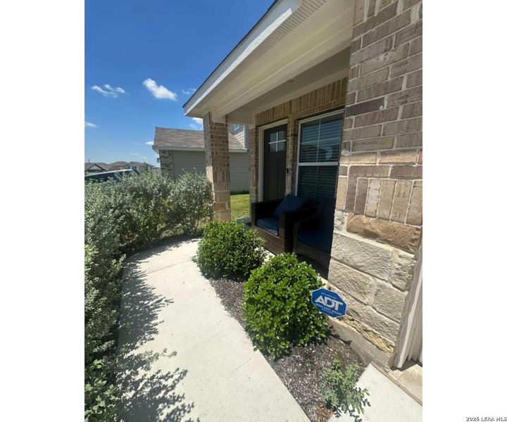 Exterior details and patio area of a home in Prairie Lakes, Buda (Image 22).