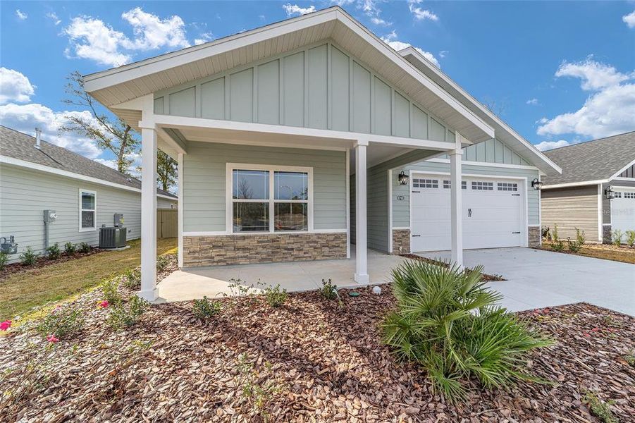 Front exterior of a new home in Grand Oaks, Gainesville, FL, highlighting curb appeal (Image 22). Front exterior of a new home in Grand Oaks, Gainesville, FL, highlighting curb appeal (Image 22).