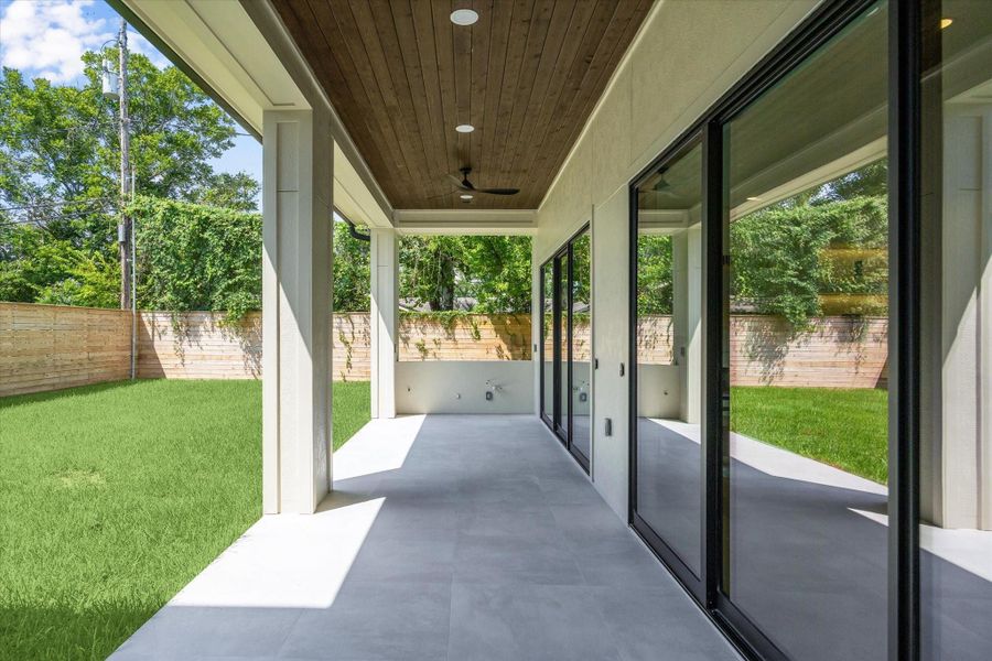 Covered patio with wood ceiling, recessed lighting, and dual fans. Summer kitchen ready! Covered patio with wood ceiling, recessed lighting, and dual fans. Summer kitchen ready!