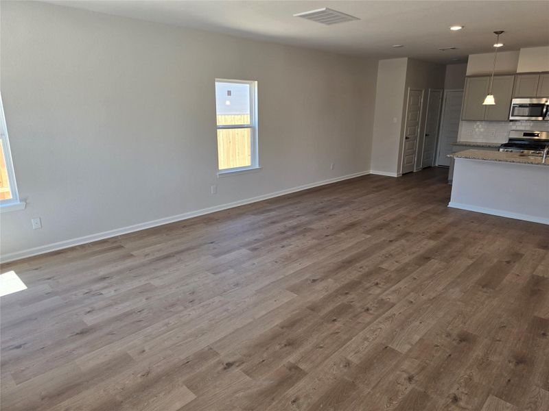 The Shetland III- Family Room into the kitchen. Home under construction. Sample floor plan photo used for illustrative purposes only. Upgrades, selections options, windows and colors may vary. The Shetland III- Family Room into the kitchen. Home under construction. Sample floor plan photo used for illustrative purposes only. Upgrades, selections options, windows and colors may vary.