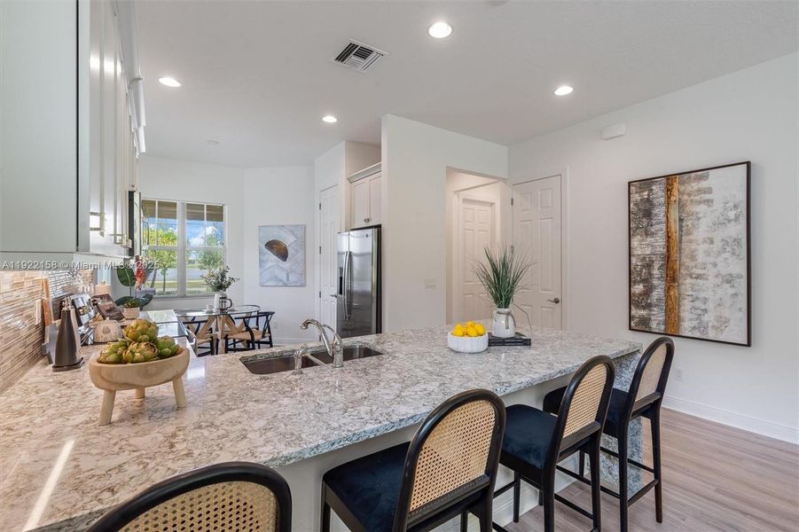 Furnished interior view inside a new home in PGA Village Verano, Port St. Lucie (Image 4).