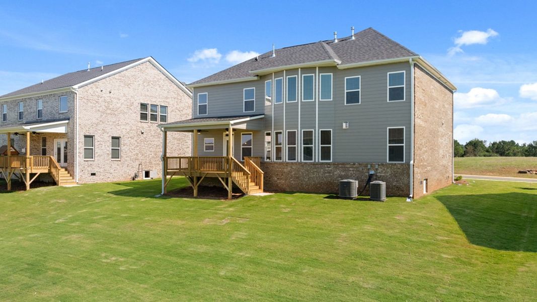 Front exterior of a new home in Heritage Pointe, Senoia, GA, highlighting curb appeal (Image 31). Front exterior of a new home in Heritage Pointe, Senoia, GA, highlighting curb appeal (Image 31).